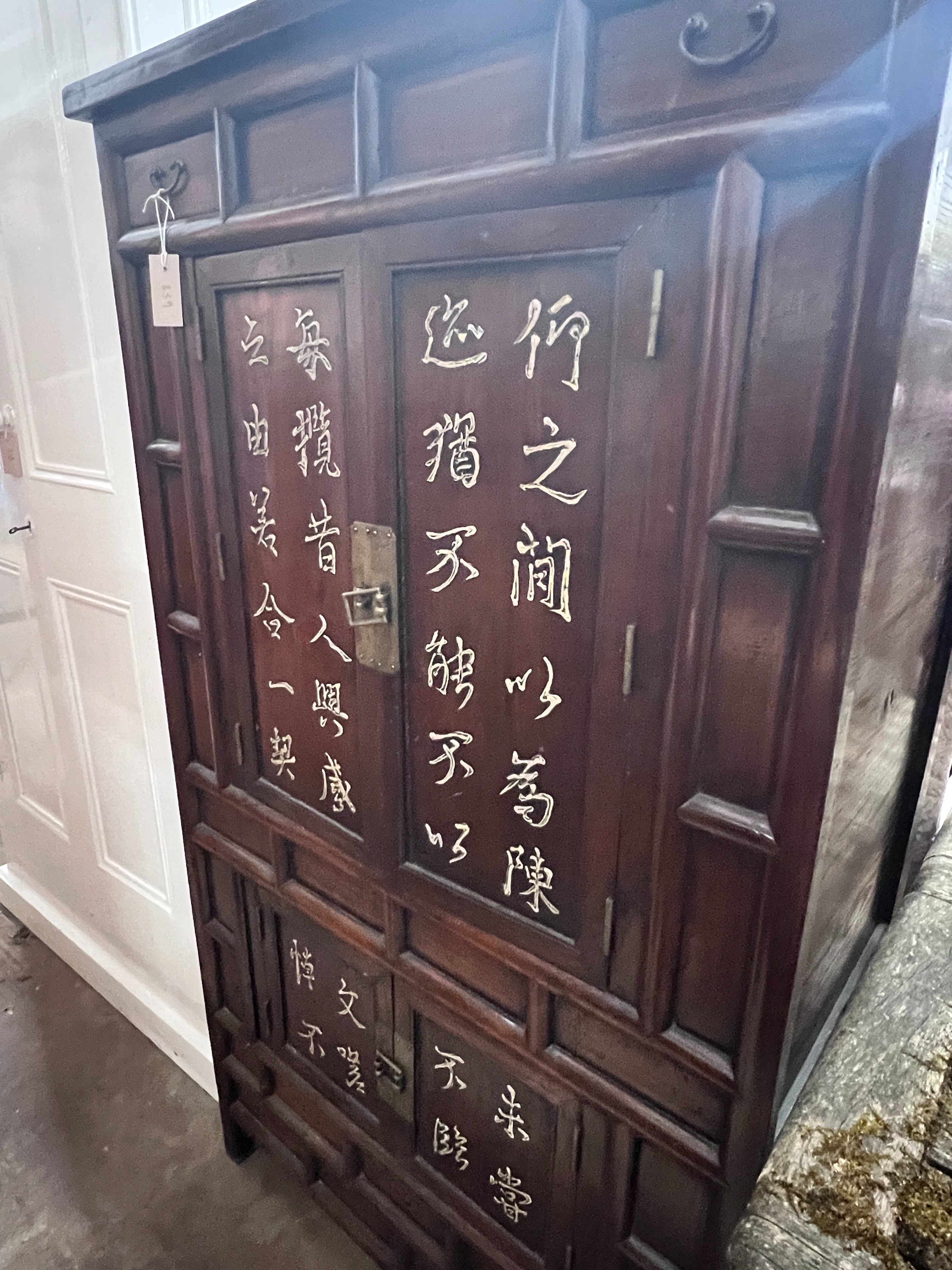 A Chinese elm cabinet, width 88cm, height 155cm *Please note the sale commences at 9am.